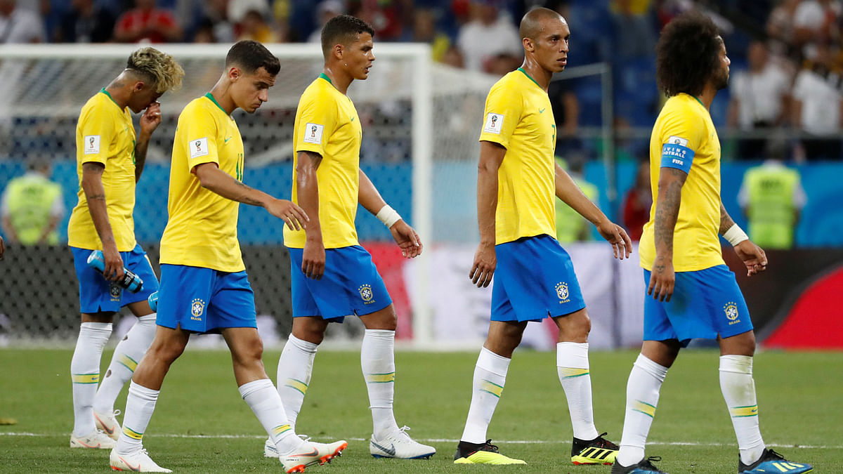 Dejected Brazil players leave the field after the game. Reuters