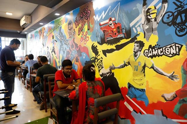 Game Inn cafe in Dhanmondi has bright murals of the football players on the wall. The cafe also screens of the matches live. Dipu Malakar took the photo recently from Dhanmondi, Dhaka.