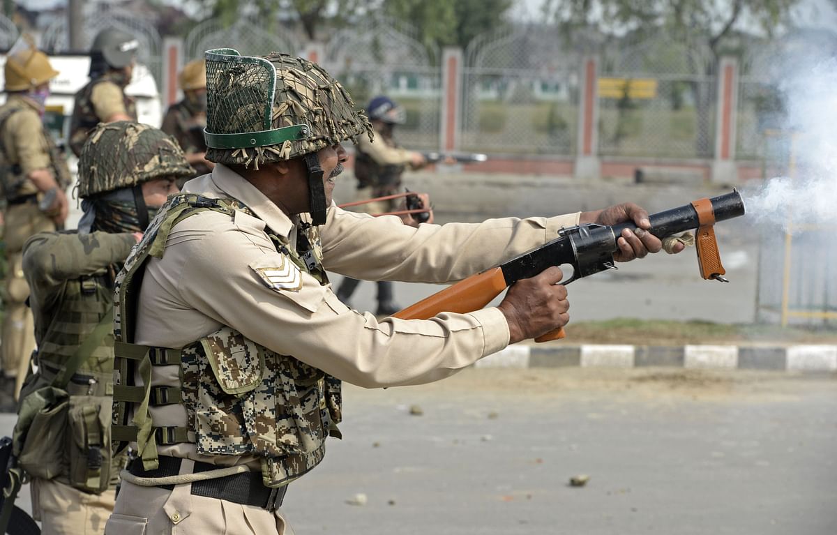 Indian police paramilitary trooper fired tear smoke shells during clashes in Srinagar on 16 June 2018. Clashes broke out after Eid prayers in Srinagar with Indian police and paramilitary forces firing tear smoke shells and pellet guns at hundreds of protesters throwing rocks at them near the main Eidgah prayer ground. Photo: AFP  Meta: India said Sunday it was resuming military operations against rebels in disputed Kashmir after a rare 30-day suspension for Ramadan expired, with a top minister blaming militant attacks.