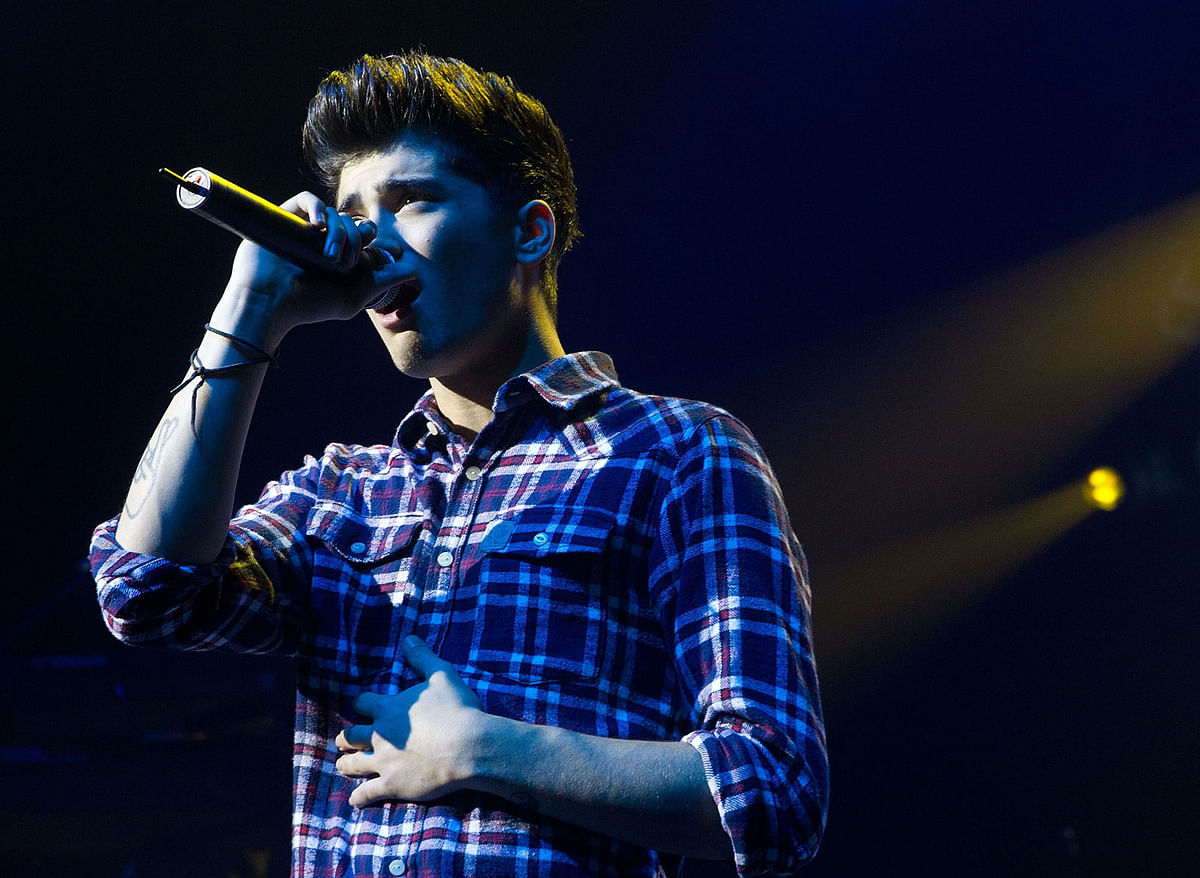In this file photo taken on 22 April, 2012 Zayn Malik of the British-Irish boy band One Direction performs during the group`s concert at the St James theatre in Wellington. Photo: AFP