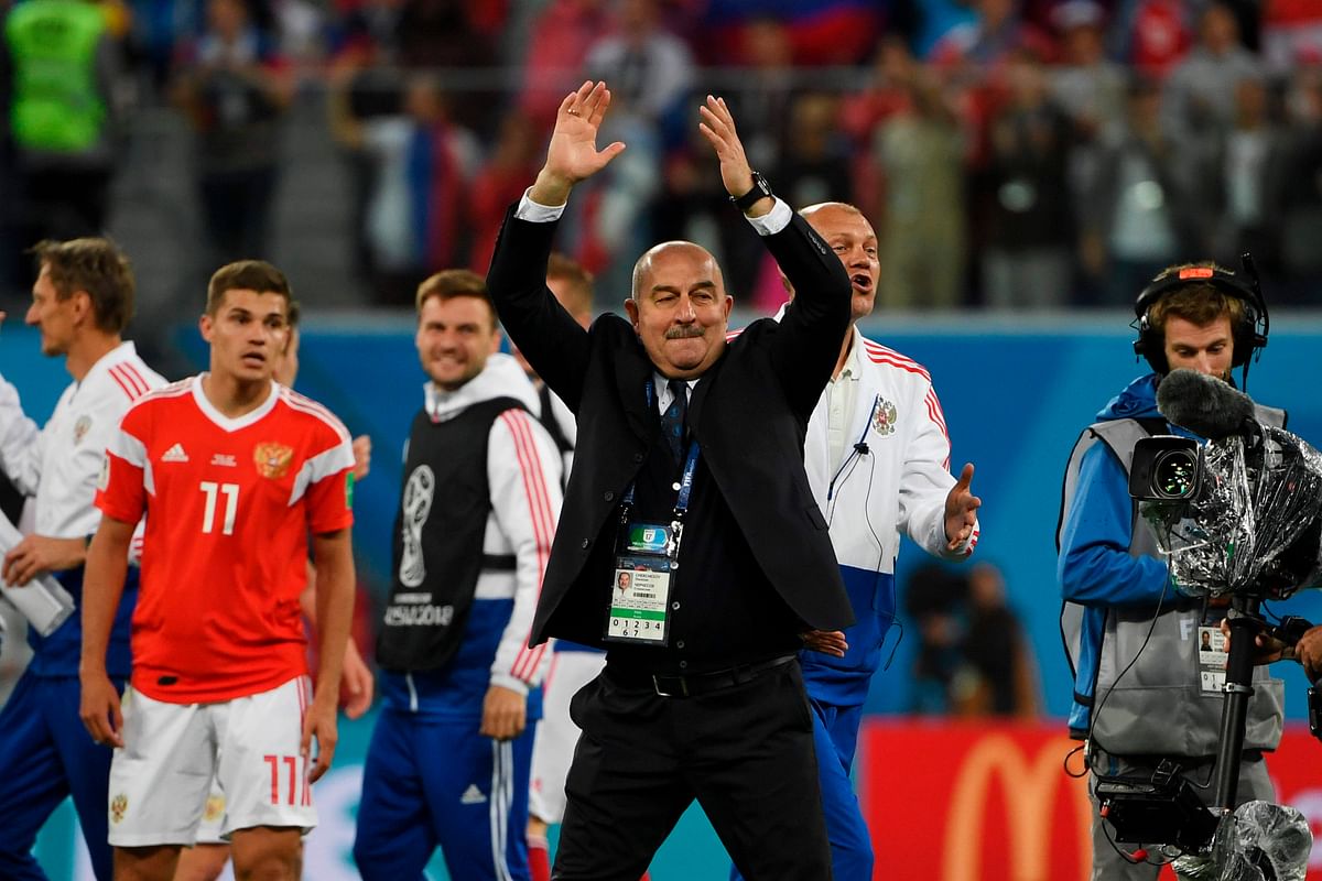 Russia coach Stanislav Cherchesov celebrates after the final whistle of the Russia 2018 World Cup Group A football match between Russia and Egypt at the Saint Petersburg Stadium in Saint Petersburg on June 19, 2018. AFP