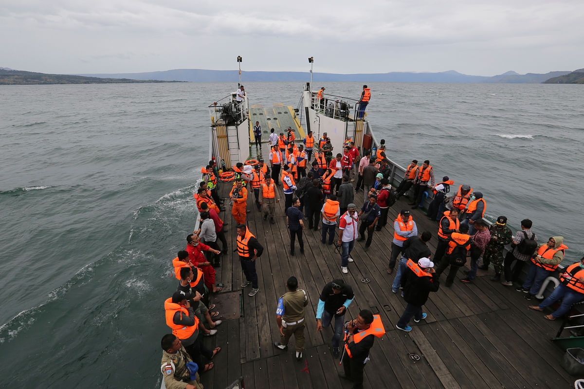 An Indonesia search and rescue team searches for a ferry which sank Monday in lake Toba, North Sumatra, Indonesia, Tuesday on 19 June 2018. Rescuers searching for dozens of people missing after a ferry sank on Indonesia`s Lake Toba have found bags, jackets, an ID card and other items in the waters but no new survivors, casting a tragic pall over holidays marking the end of the Muslim holy month. Photo: AP
