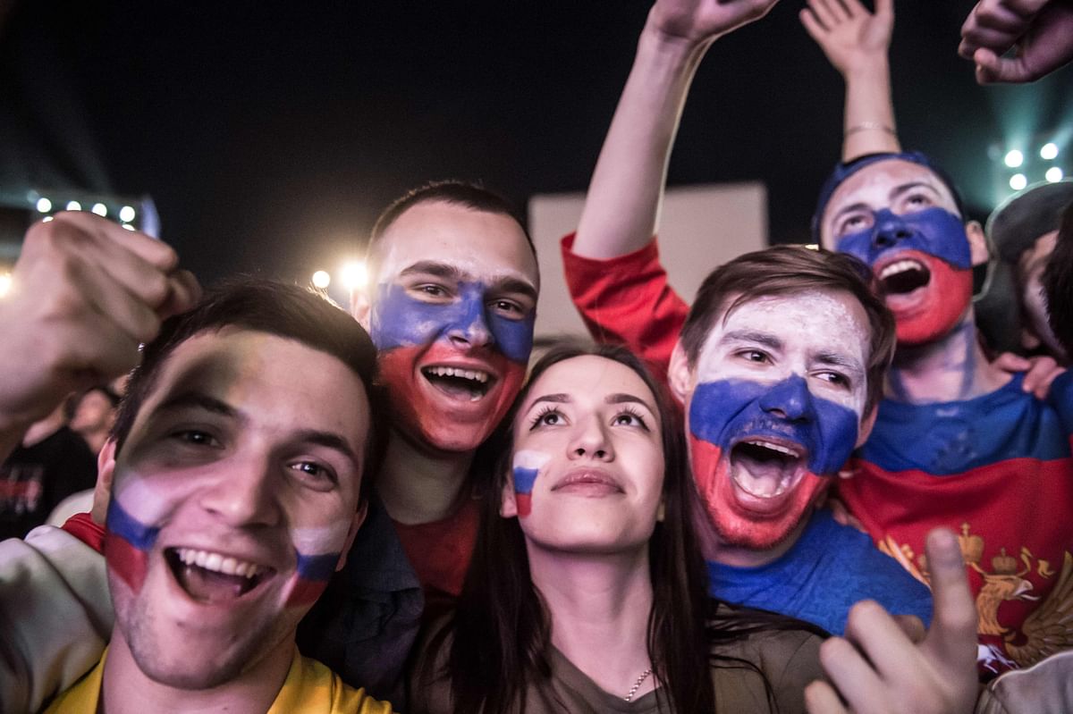Russian football fans celebrate after their teams victory in the Russia 2018 World Cup Group A football match between Russia and Egypt, at the Fan Zone in Rostov-on-Don on June 19, 2018. AFP