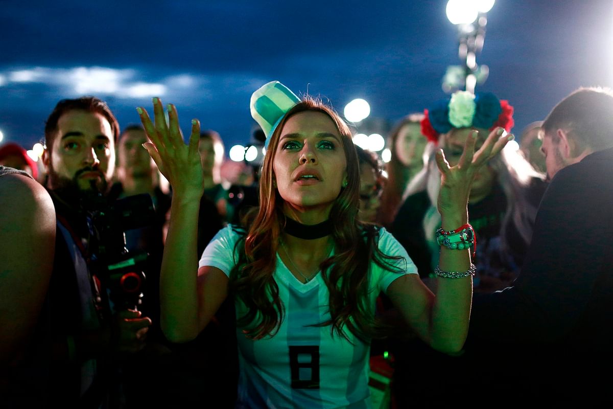 An Argentina fan at the Fan Zone in Kazan reacts as she watches a live broadcast of the Russia 2018 World Cup football match between Argentina and Croatia on 21 June 2018. AFP