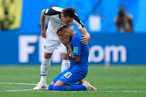 Costa Rica`s defender Bryan Oviedo talks to Brazil`s forward Neymar as he cries after scoring a goal during the Russia 2018 World Cup Group E football match between Brazil and Costa Rica at the Saint Petersburg Stadium on 22 June. Photo: AFP