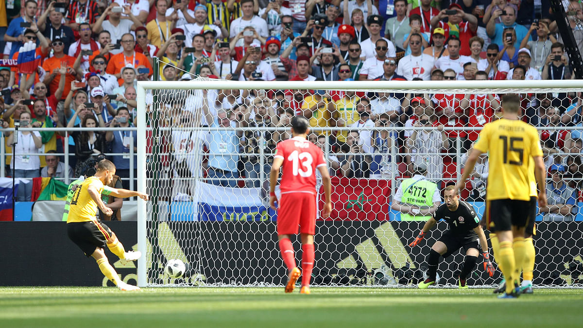 Belgium`s Eden Hazard scores their first goal from a penalty against Belgium in Moscow’s Spartak Stadium on 23 June. Photo: Reuters