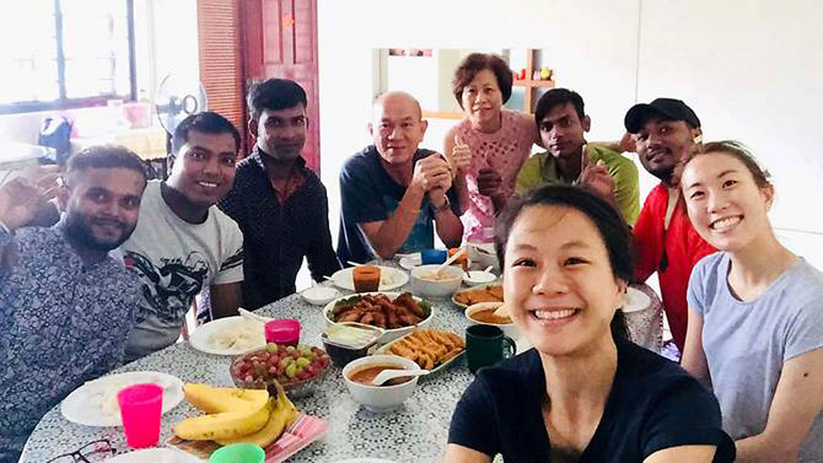 Marlene Chua, 28 (extreme right) and her sister with their guests on 17 June. Photo source: CNA Insider