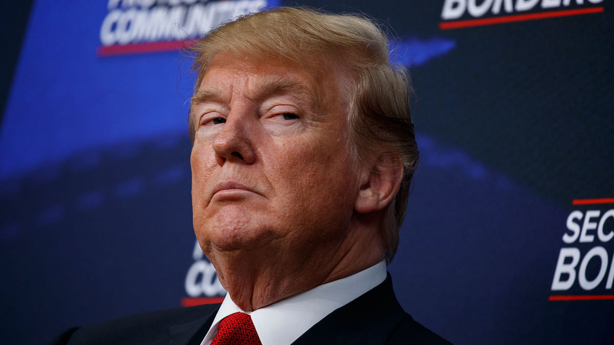 President Donald Trump listens during an event on immigration alongside family members affected by crime committed by undocumented immigrants, at the South Court Auditorium on the White House complex on 22 June. Photo: AP