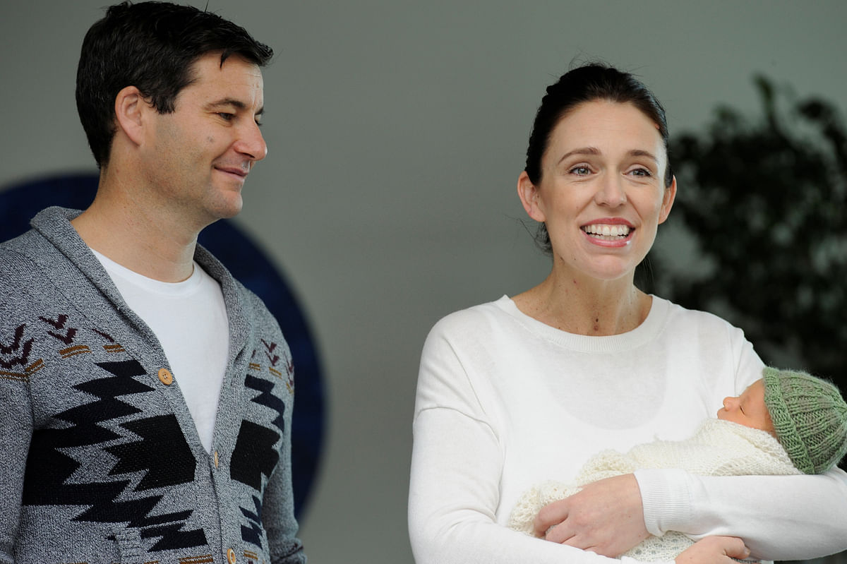 New Zealand prime minister Jacinda Ardern carries her newborn baby Neve Te Aroha Ardern Gayford with her partner Clarke Gayford as she walks out of the Auckland Hospital in New Zealand on 24 June. Photo: Reuters