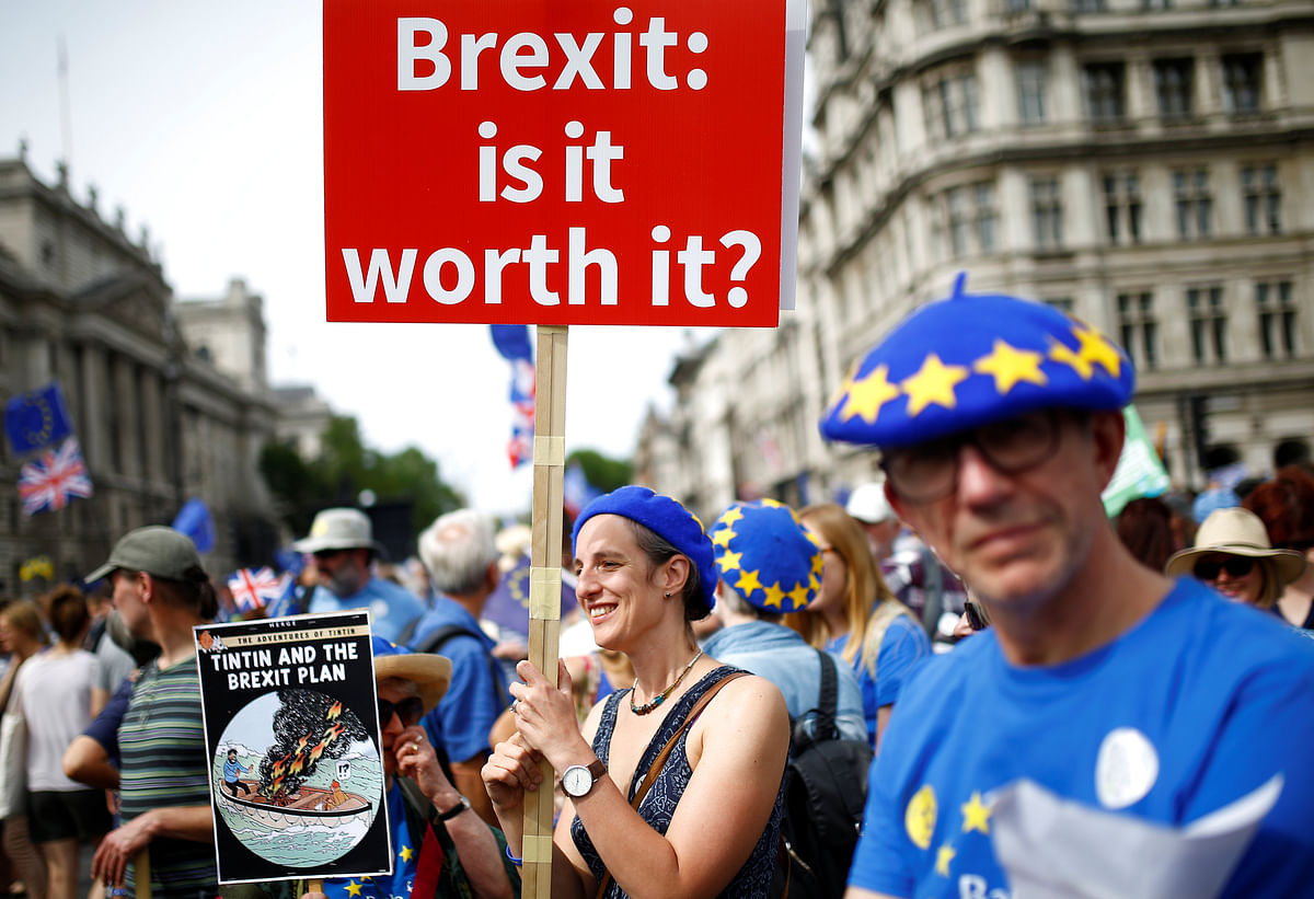 A woman holds a placard as she joins EU supporters, calling on the government to give Britons a vote on the final Brexit deal, participating in the `People`s Vote` march in central London, Britain on 23 June 2018. Photo: Reuters