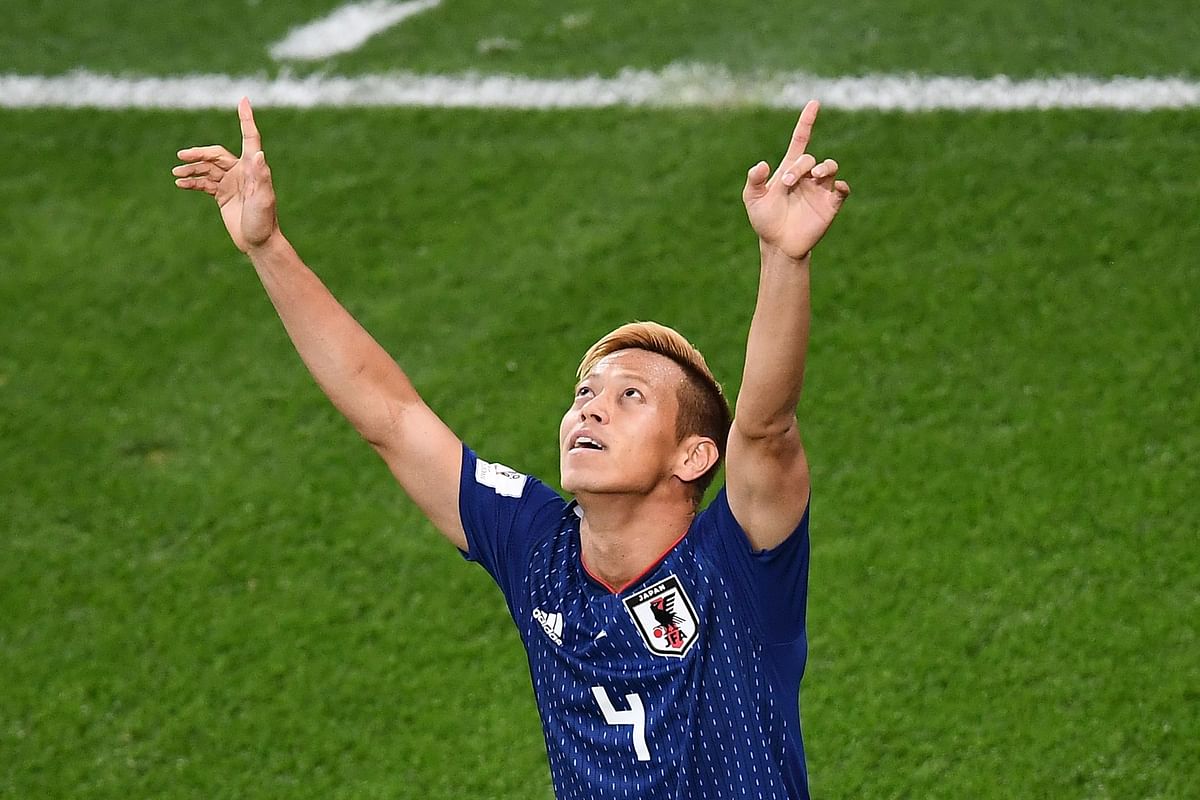 apan`s midfielder Keisuke Honda celebrates a goal during the Russia 2018 World Cup Group H football match between Japan and Senegal at the Ekaterinburg Arena in Ekaterinburg on 24 June 2018. Photo: AFP