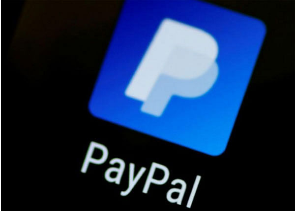 The PayPal app logo seen on a mobile phone in this illustration photo on 16 October 2017. - Reuters
