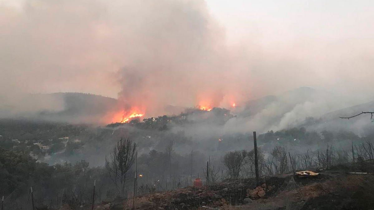 In this photo provided by the California Department of Forestry and Fire Protection, the Pawnee Fire wildfire burns in the Spring Valley area, northeast of Clearlake Oaks in Lake County, California on 24 June. Photo: AP