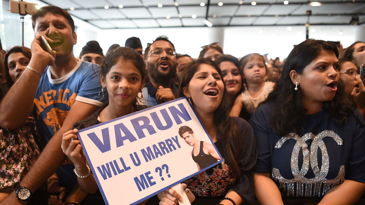 Fans of Indian Bollywood actor Varun Dhawan cheer during a celebrity event at the sidelines of the 19th International Indian Film Academy (IIFA) festival in Bangkok on 24 June 2018. Photo: AFP