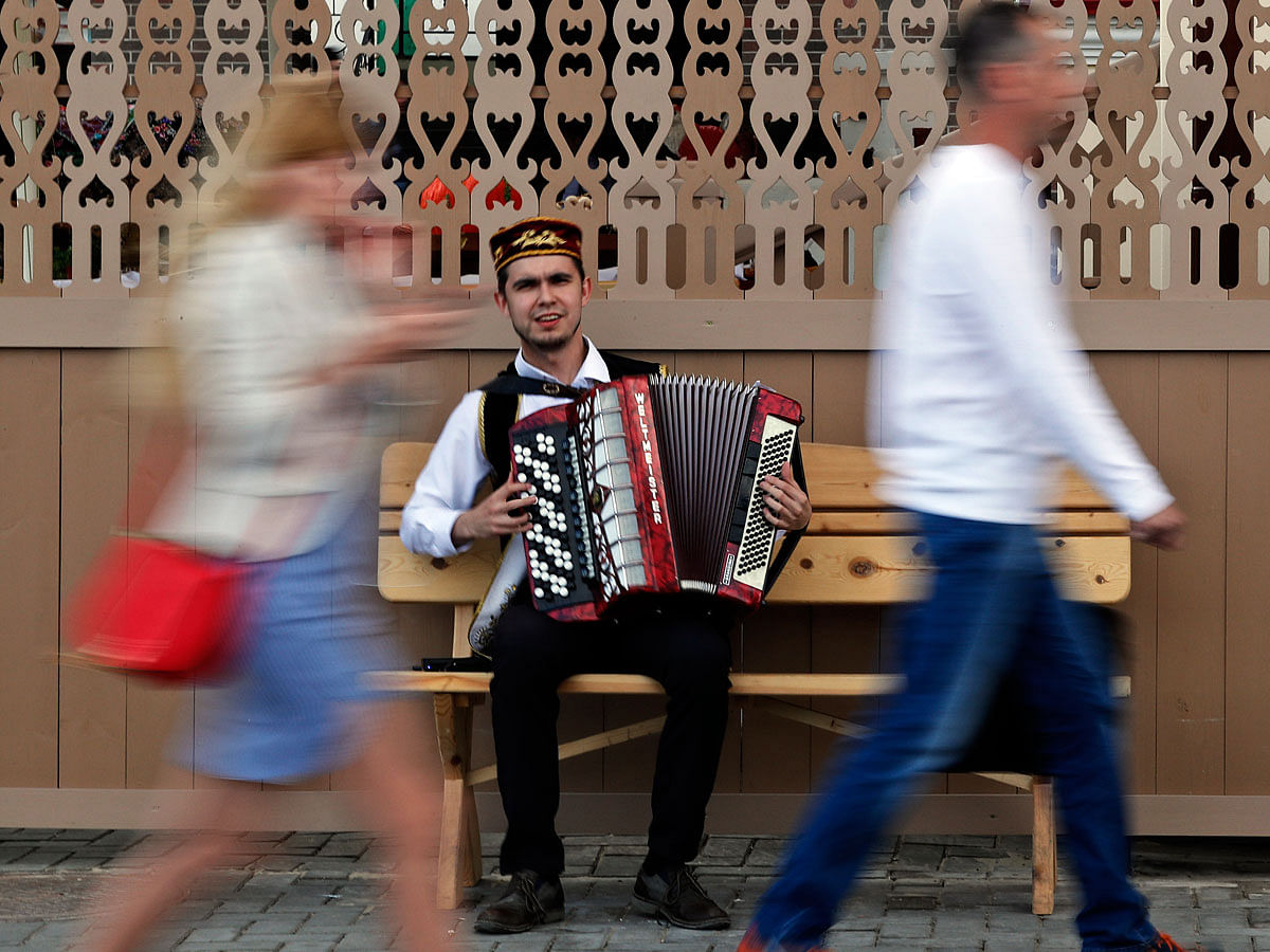 A street musician plays the accordion during the 2018 soccer World Cup in Kazan the capital of the Republic of Tatarstan, Russia on 21 June: Photo: AP