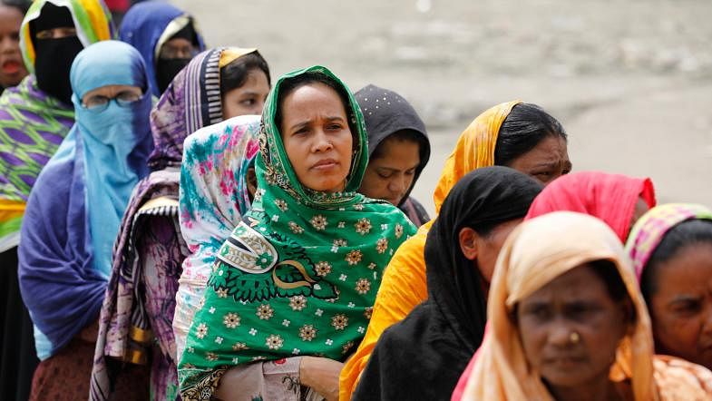 A section of women voters wait to cast their votes in the Gazipur City Corporation polls at Auchpara Government Primary School on 26 June. Photo: Dipu Malakar