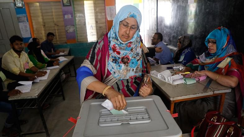 A woman cast her vote in the Gazipur City Corporation elections at Auchpara Government Primary School on 26 June. Photo: Dipu Malakar