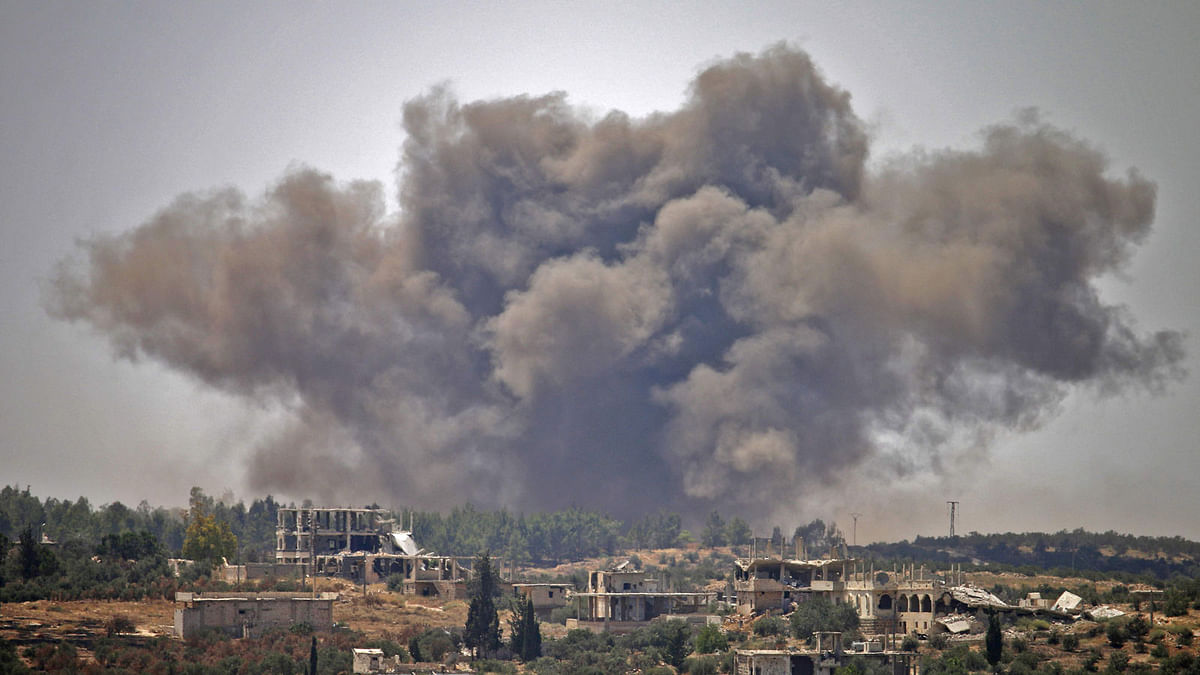 Smoke rises above opposition held areas of the city of Daraa during airstrikes by Syrian regime forces on 28 June. Photo: AFP