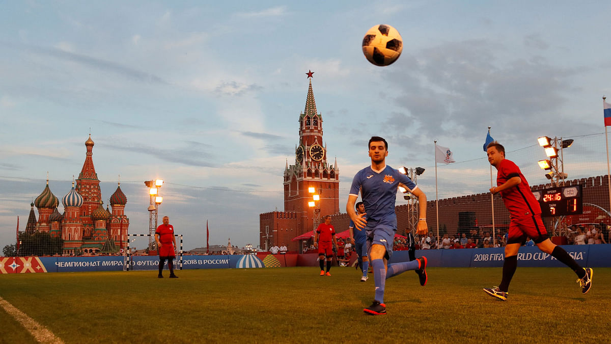 Players take part in a soccer match between the Millennium United amateur soccer team and a team of film and theatre actors in the World Cup Football Park in Red Square in central Moscow, Russia on 29 June 2018. Photo: Reuters