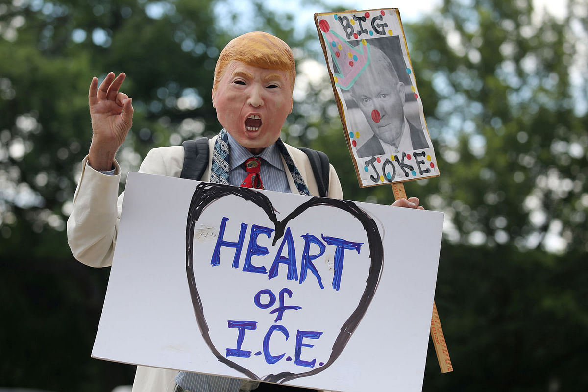 A demonstrator dressed as US president Donald Trump marches as immigration activists rally as part of a march calling for `an end to family detention` and in opposition to the immigration policies of the Trump administration, in Washington, US on 28 June. Reuters