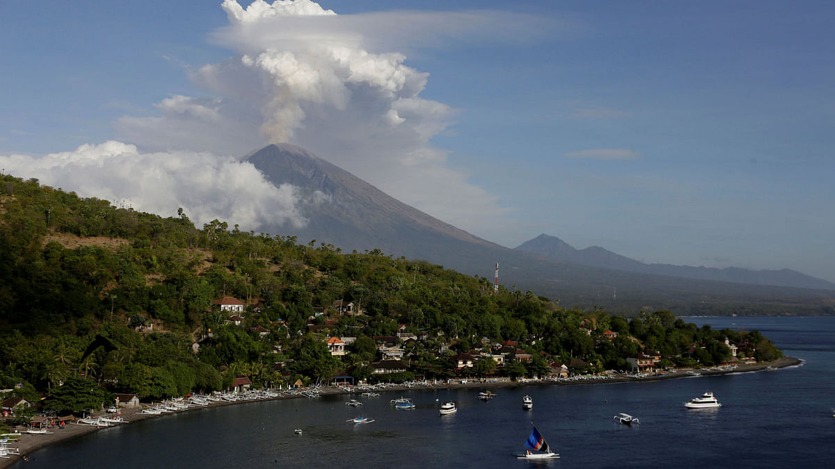 Mount Agung volcano can be seen erupting  from Amed in Karangasem Regency, Bali, Indonesia on 29 June. Photo: Reuters