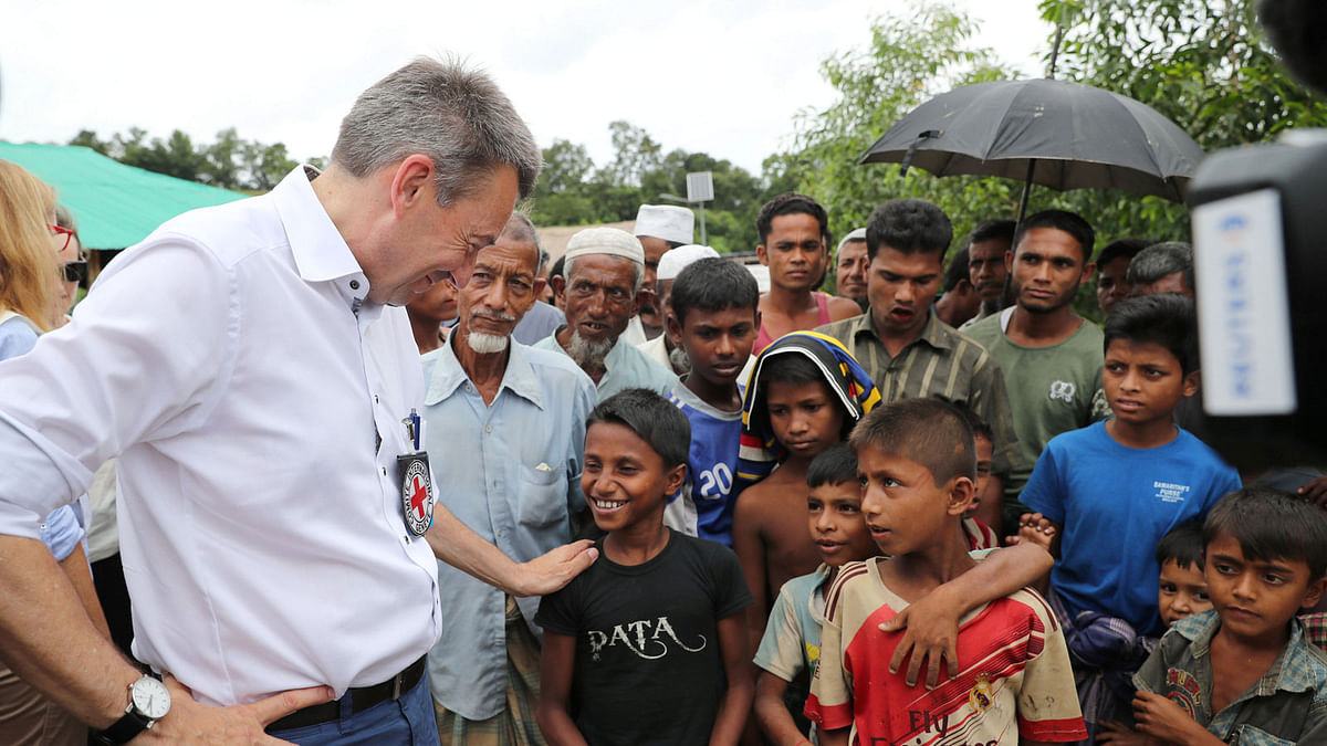ICRC President Maurer interacts with Rohingya children during his visit to a refugee camp in Cox`s Bazar. Photo: Reuters