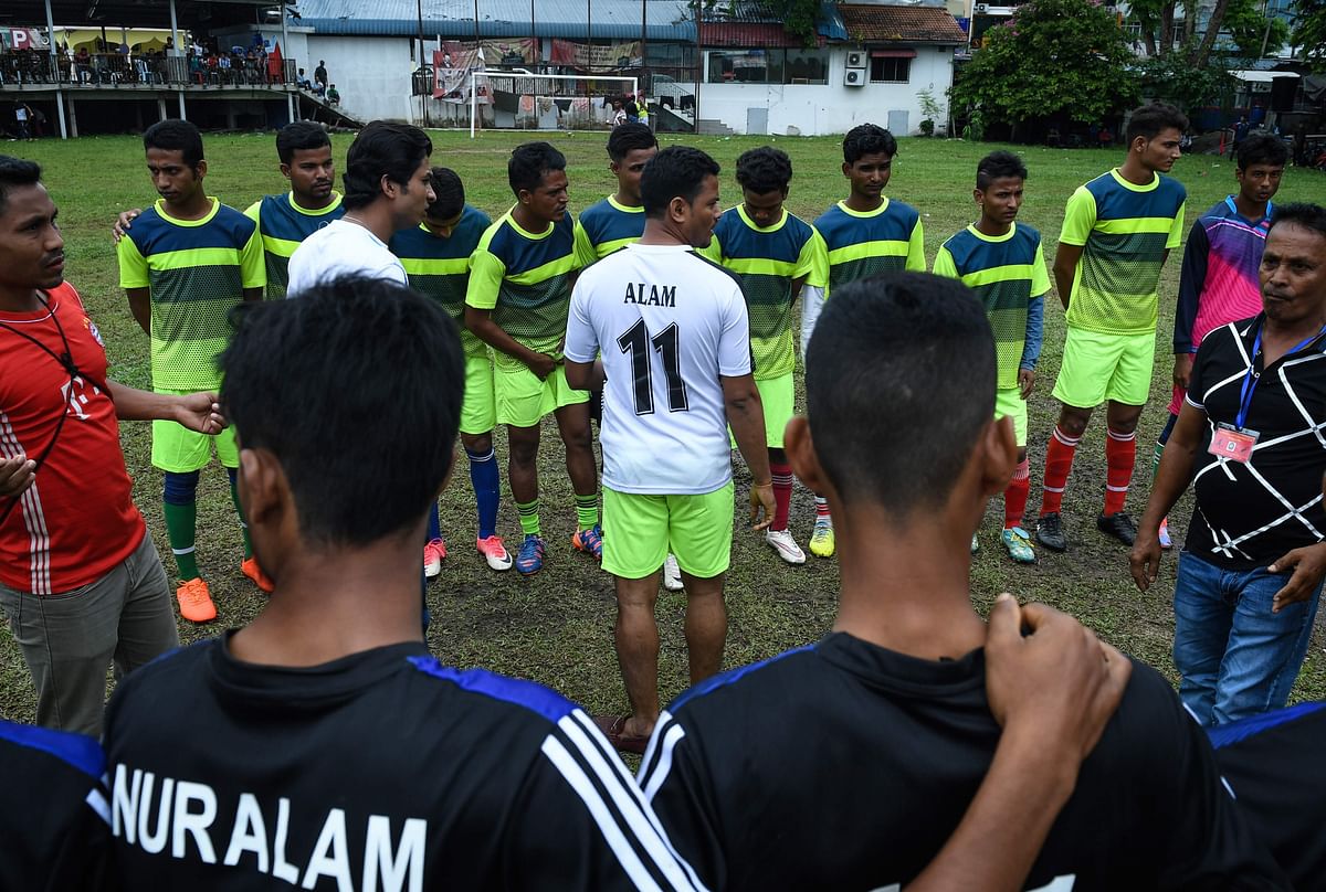 This picture taken on 17 June 2018 shows players from Rohingya FC (top) facing players from the Rohingya team Cheras Harimau (bottom) during a three-day tournament for refugees, marking the Eid al-Fitr Islamic festival, on the outskirts of Kuala Lumpur. They may lack the glitz and glamour of the World Cup, but football clubs for stateless Rohingya refugees in Malaysia offer something more -- a 90-minute reprieve from a grinding existence on the fringes of society. Photo: AFP