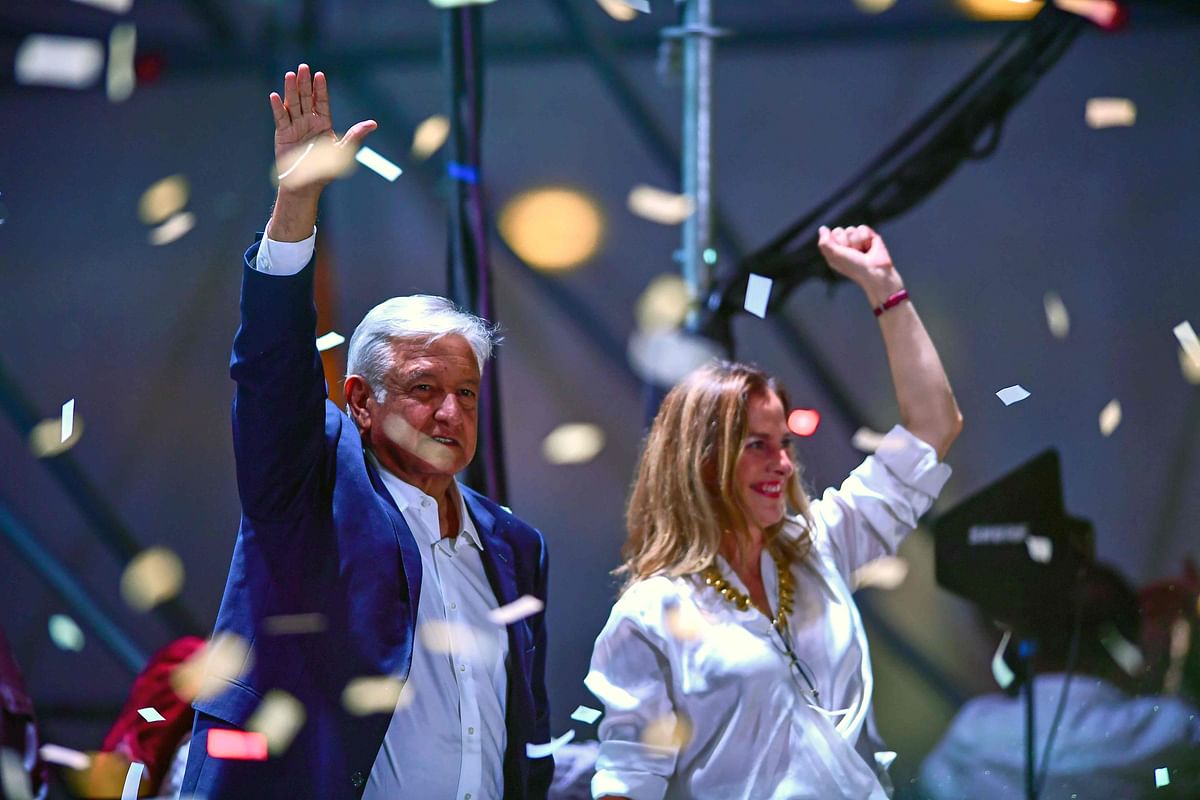 Presidential candidate Andres Manuel Lopez Obrador gestures with his wife Beatriz Gutierrez Muller and family as he addresses supporters after polls closed in the presidential election, in Mexico City, Mexico on 1 July. Photo: Reuters
