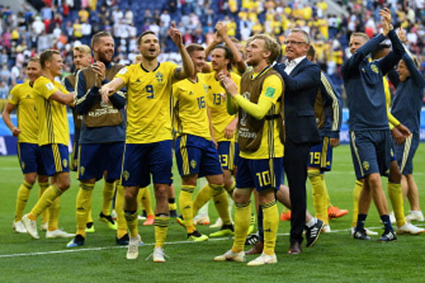 Sweden`s forward Marcus Berg (09) and teammates celebrate their victory at the end of the Russia 2018 World Cup round of 16 football match between Sweden and Switzerland at the Saint Petersburg Stadium in Saint Petersburg on 3 July 2018.