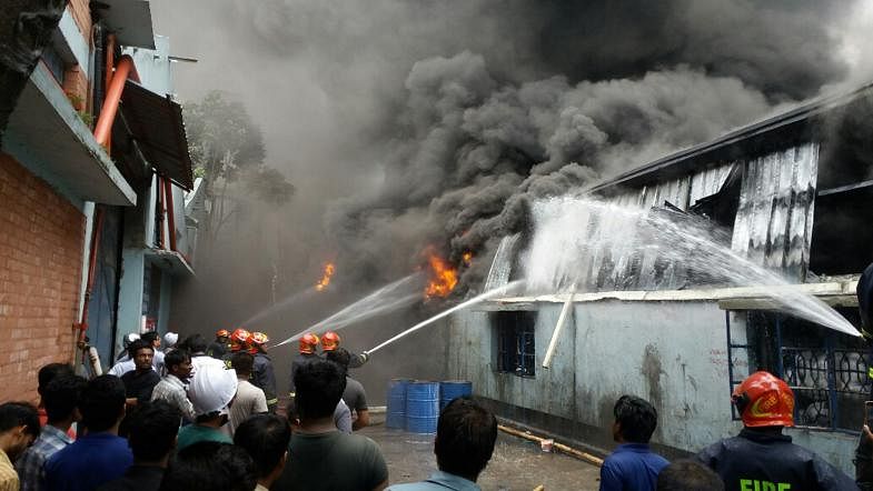 Fire service men work to douse the blaze at a factory in Borobari area of Tongi upazila in Gazipur on 3 July. Photo: Masud Rana
