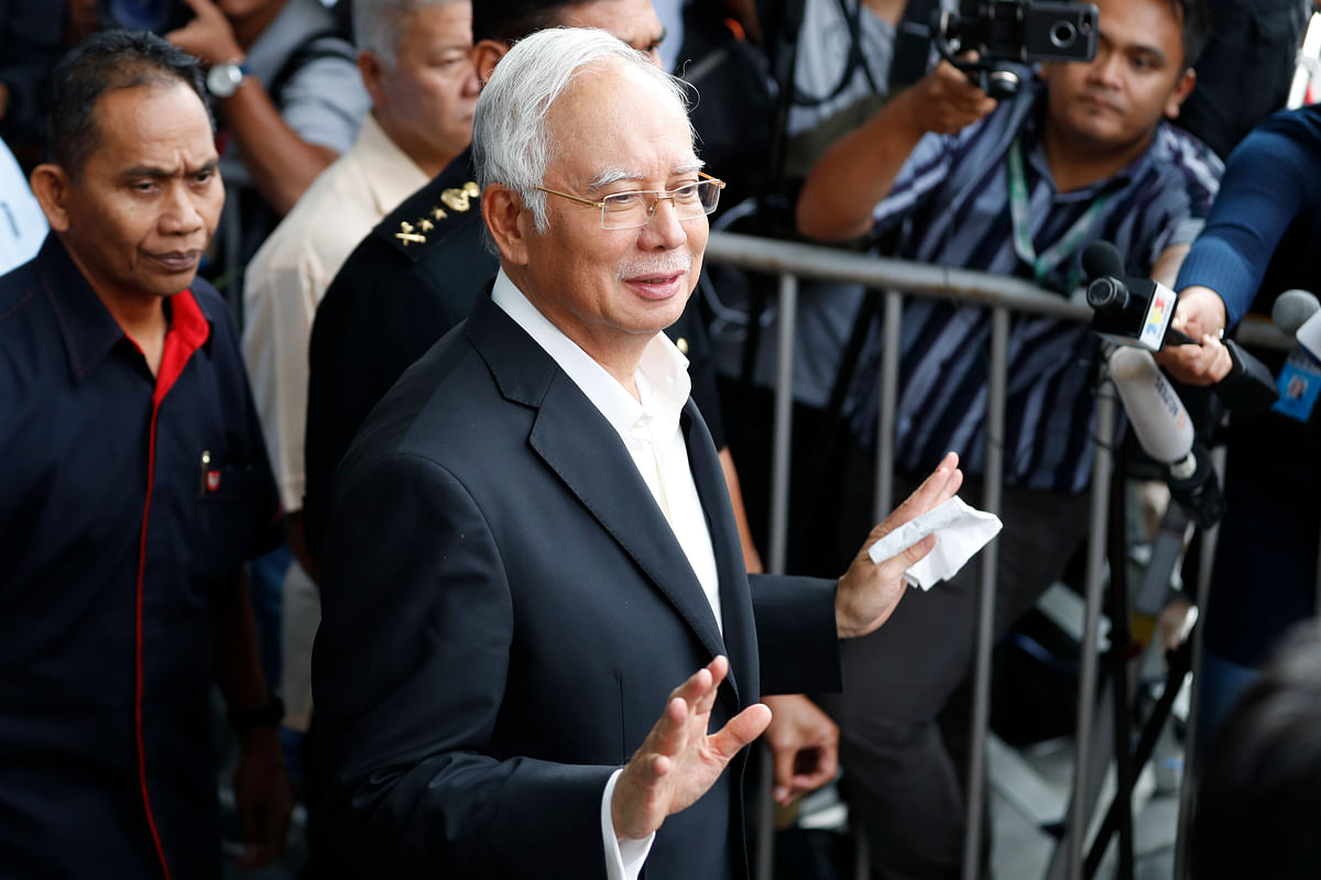 In this photo taken on 24 May, former Malaysian prime minister Najib Razak, centre, speaks to media as he leaves the Malaysian Anti-Corruption Commission (MACC) Office in Putrajaya in Kuala Lumpur. Photo: AP