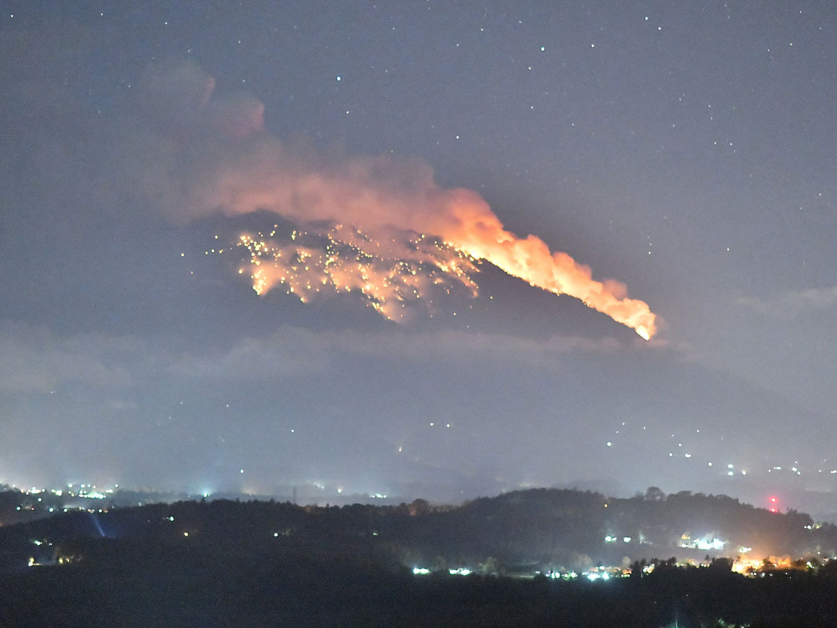 Mount Agung volcano erupts during the night, as seen from Bugbug village in Karangasem regency in Bali, Indonesia on 2 July. Photo: Reuters