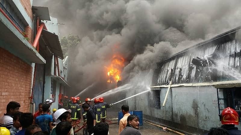Fire fighters are seen trying to bring the fire under control at a foam factory in Borobari area of Gazipur city on Tuesday (3 July 2018). -- Photo: UNB
