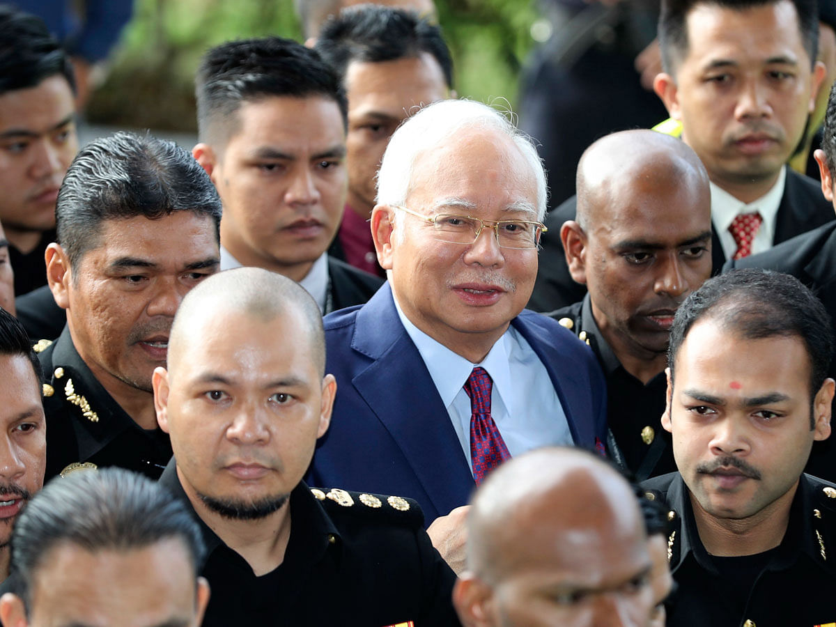 Former Malaysian Prime Minister Najib Razak, center, arrives at a court house in Kuala Lumpur, Malaysia on 4 July. Photo: AP