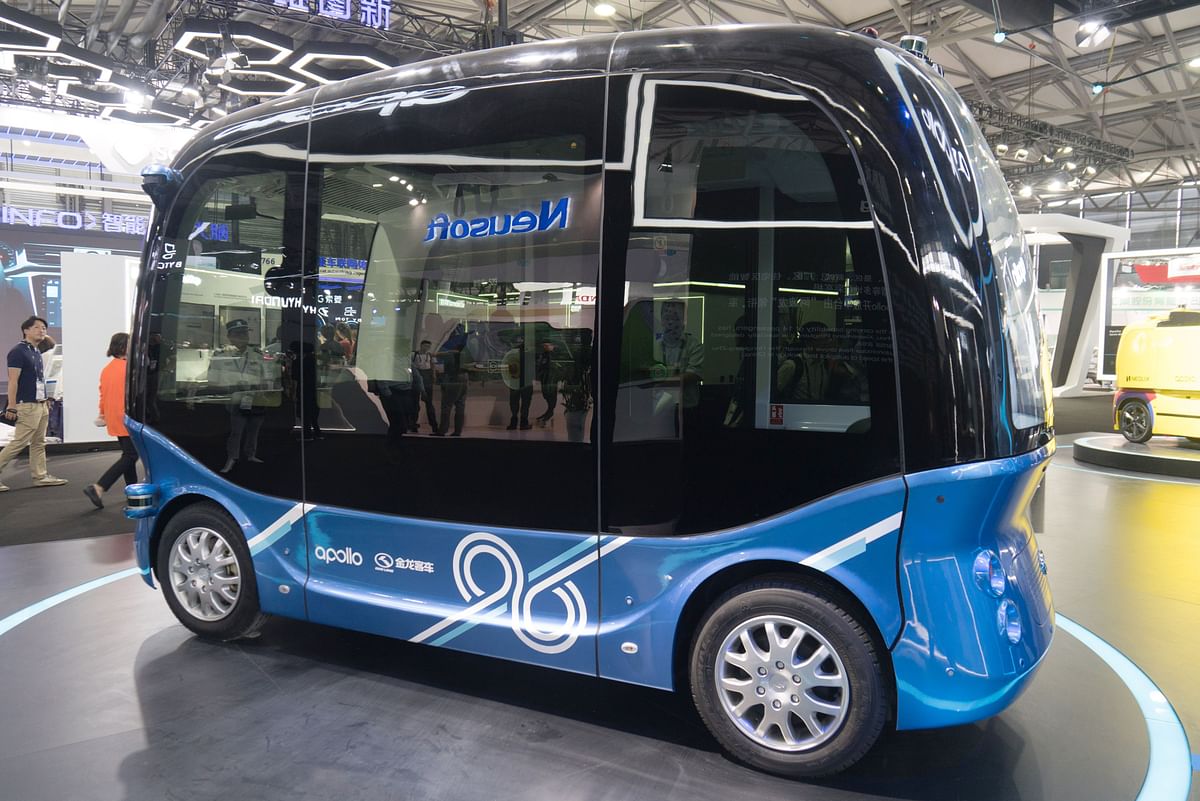 This file picture taken on 13 June 2018 shows an Apolong self-driving mini bus by King Long exhibited at the Consumer Electronics Show (CES) Asia in Shanghai. China`s internet giant Baidu announced on 4 July 2018 it had begun mass producing the country`s first autonomous mini-bus, as the firms prepares to roll them out in tourist spots and airports. Photo: AFP