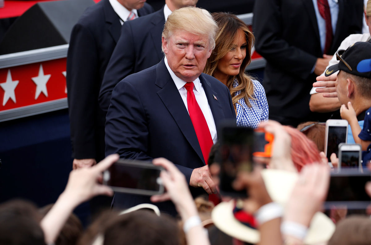 US president Donald Trump and US first lady Melania Trump greet people during a picnic for military families celebrating Independence Day at the White House in Washington, US on 4 July 2018. Photo: Reuters