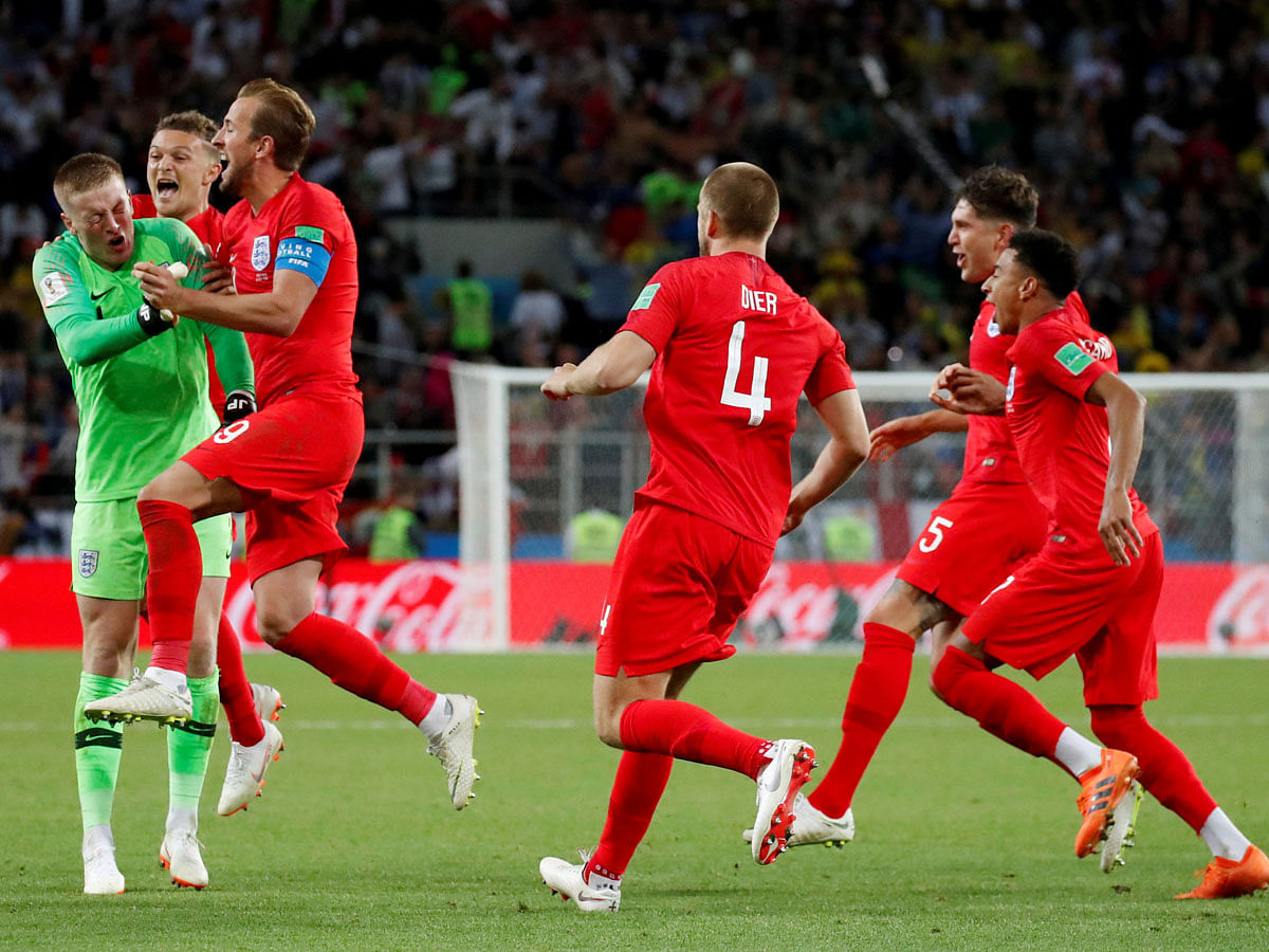 England`s Eric Dier celebrate winning the penalty shootout with team mates on 3 July 2018. Photo: Reuters