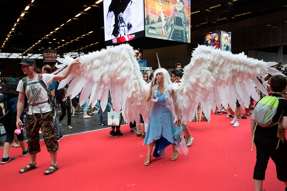A cosplayer wears a winged costume as she arrives for the 2018 Japan Expo exhibition on 5 July  in Villepinte, near Paris. Photo: AFP