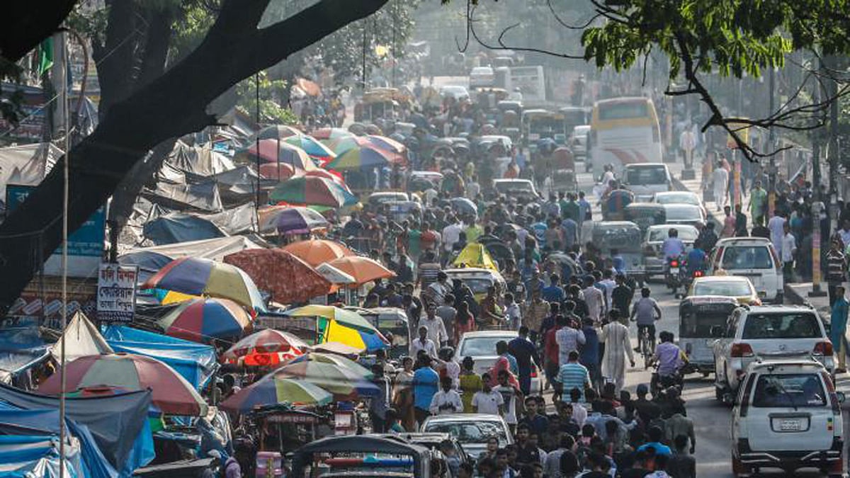 There is little space remaining on the road as most of it is grabbed by hawkers. The result is an inevitable traffic jam. The picture was taken by Dipu Malakar from Indira Road, Farmgate, Dhaka by Dipu Malakar