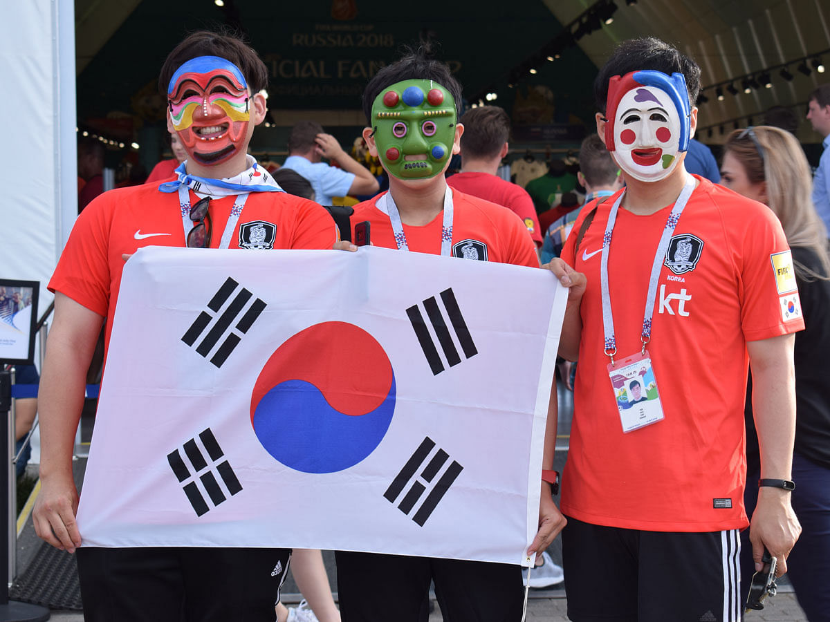 Proud South Korean fans in front of a FIFA Official Shop. Photo : Quamrul Hassan