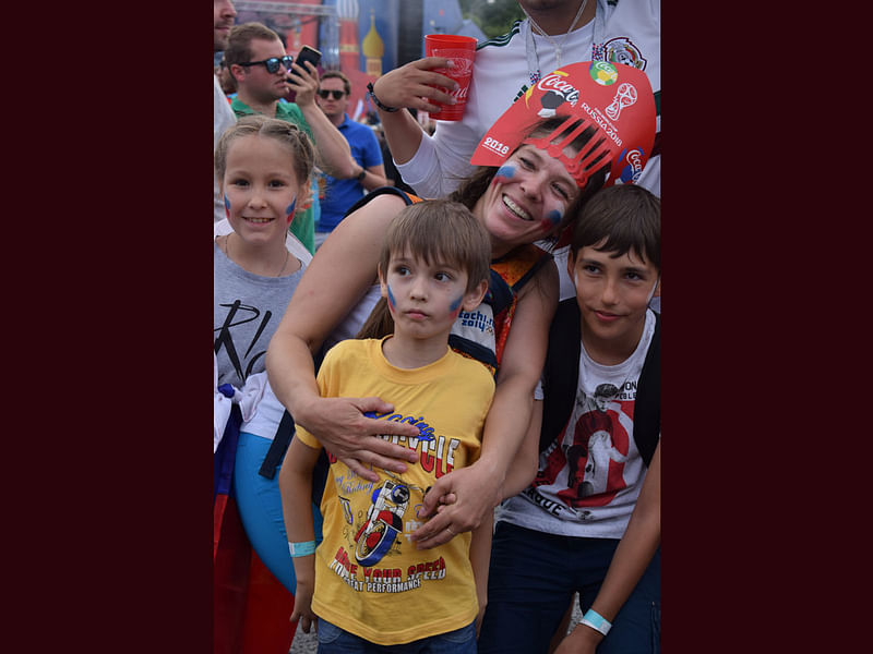 A football loving mother with her three children at the FIFA Fan Fest. Photo : Quamrul Hassan