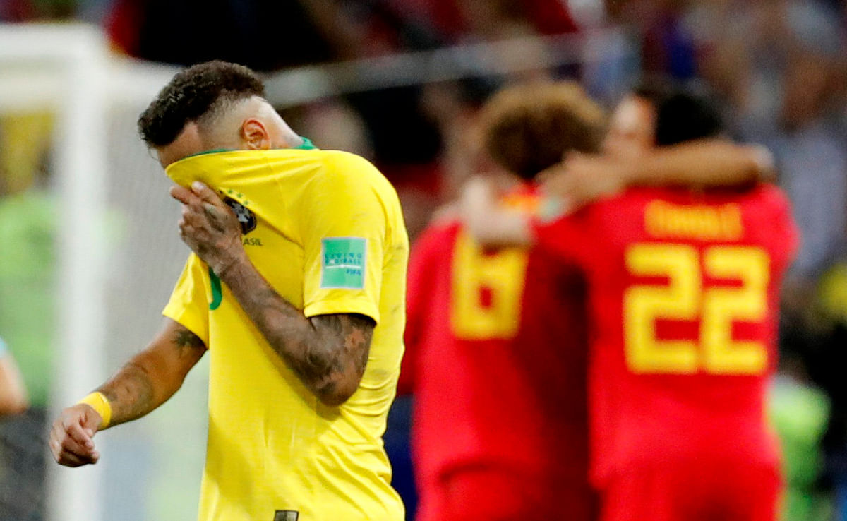 Brazil`s Neymar looks dejected at the end of the match as Belgium players celebrate in Russia`s Kazan Arena, Kazan on 6 July, 2018. Photo: Reuters