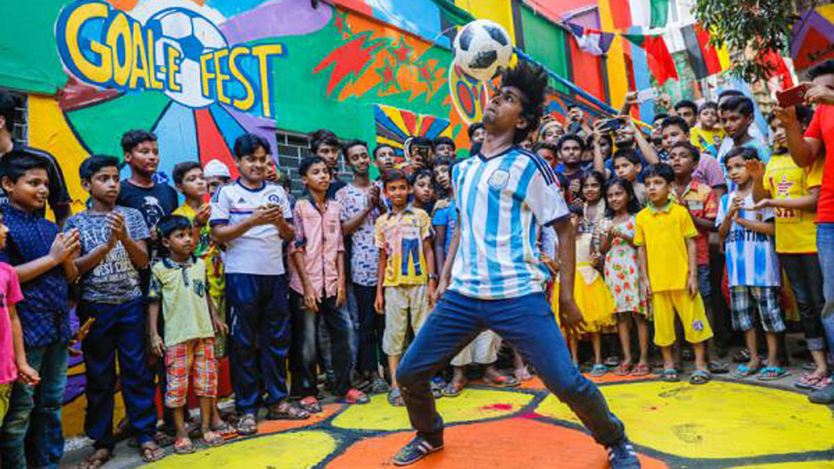 Janala Bangladesh arranged `Goal-e Fest`, celebrating the on-going FIFA World  Cup at Football Alley in Old Dhaka. The programme was held to celebrate the football craze of the people of Bangladesh. Kolta Bazar, Old Dhaka, 7 July. Photo: Dipu Malakar