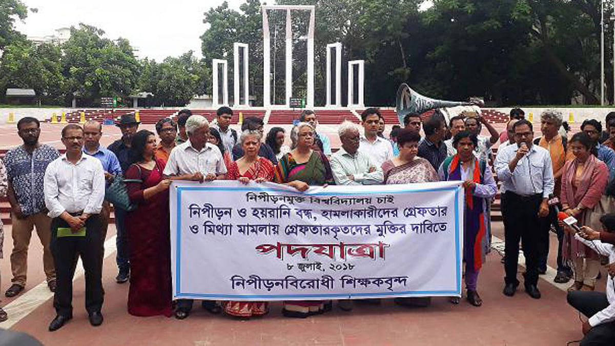 University teachers under banner of ‘Teachers Against Repression’ bring out a procession on Dhaka University campus on Sunday, in protest against the attack on quota reformists by the ruling party’s student wing Bangladesh Chhatra League (BCL). Photo: Sazid Hossain