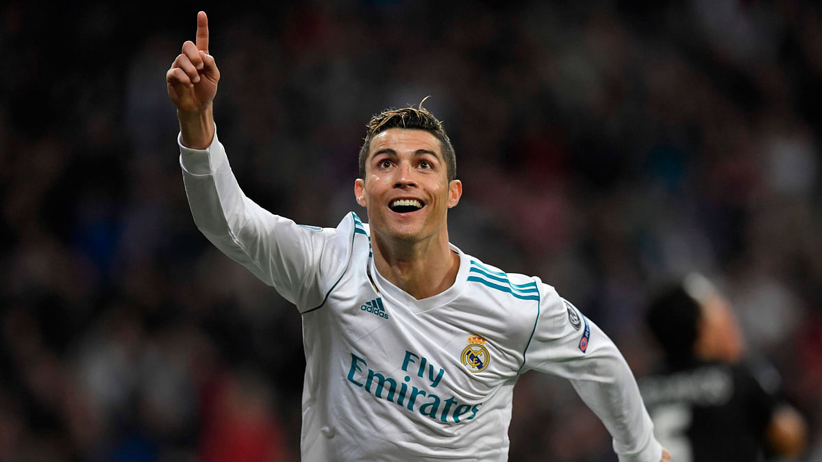In this file photo taken on 14 February 2018 Real Madrid`s Portuguese forward Cristiano Ronaldo celebrates after scoring his second goal during the UEFA Champions League round of sixteen first leg football match Real Madrid CF against Paris Saint-Germain (PSG) at the Santiago Bernabeu stadium in Madrid. Photo: AFP