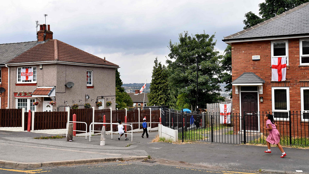 England flags decorate houses in Sheffield, northern England, on July 9, 2018 the birthplace of England`s Kyle Walker, Harry Maguire and Jamie Vardy, three members of the England national football squad that will play against Croatia on July 11 for a spot in the 2018 Russia World Cup final. Football fever is sweeping England after its young team unexpectedly progressed to the last four of the World Cup, and nowhere more so than in Sheffield, the proclaimed birthplace of the modern game. Around 150 miles north of London, it has a rich football history continuing today, with three players in the current squad, including quarter-final goal-scoring hero Harry Maguire, who were raised there. AFP
