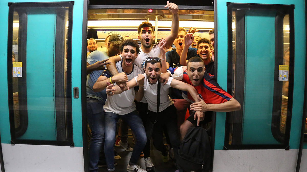 People celebrate France`s 1-0 victory on the Metro in Paris on July 10, 2018, after the final whistle of the Russia 2018 World Cup semi-final football match between France and Belgium. Photo: AFP