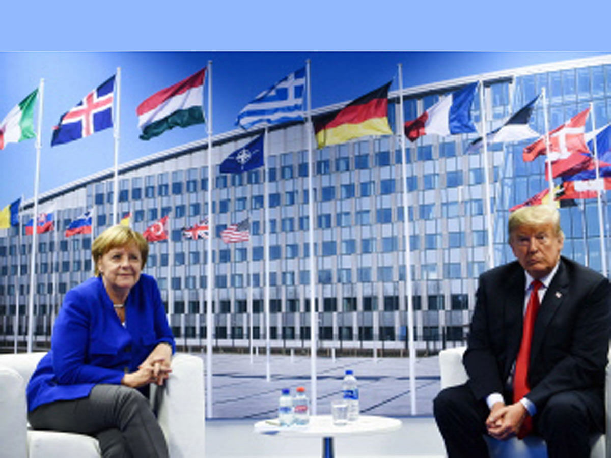 German Chancellor Angela Merkel (L) and US President Donald Trump (R) make a statement to the press after a bilateral meeting on the sidelines of the NATO (North Atlantic Treaty Organization) summit at the NATO headquarters, in Brussels, on 11 July 2018. Photo: AFP