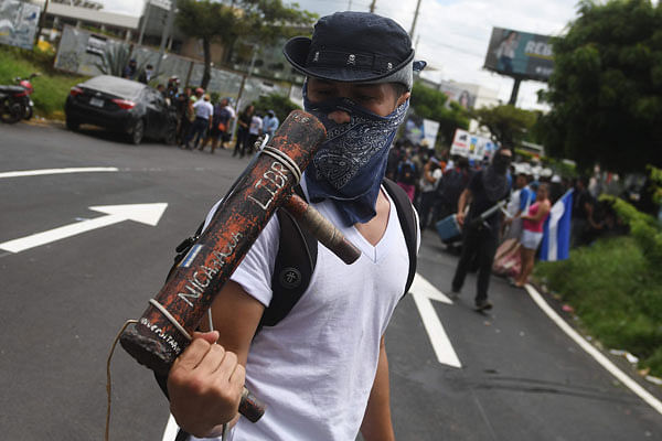 A man holds a homemade mortar during a protest against Nicaraguan President Daniel Ortega`s government in Managua, on 4 July 2018. Photo: AFP