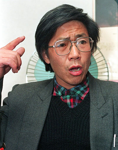 In this file photo taken on 17 November 1993 Chinese dissident Qin Yongmin gestures during a press conference in Beijing. Qin, a prominent Chinese political campaigner, was sentenced to 13 years in jail on 11 July 2018, a court in central China said. Qin was found `guilty of subversion of state power,` the Wuhan City Intermediate People`s Court said on its official website. Photo: AFP